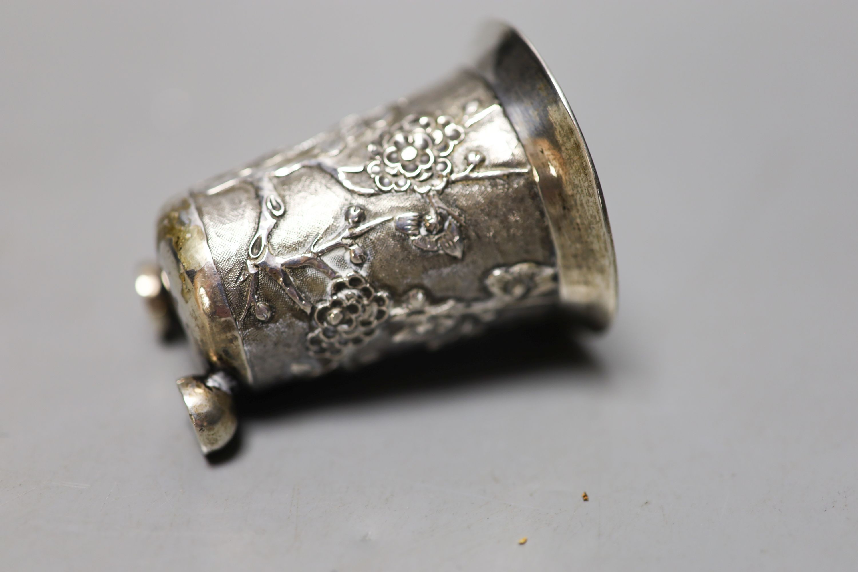 Six assorted silver mounted glass toilet jars, including a powder bowl and a Chinese white metal tot(a.f.).